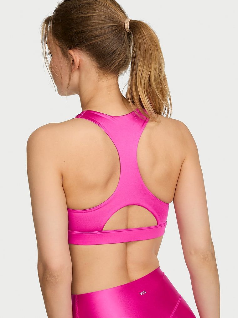 Sportski grudnjak izrađen od sjajnog VSX GlossyTech materijala. Proizvod je ružičaste boje i dolazi iz VSX kolekcije.