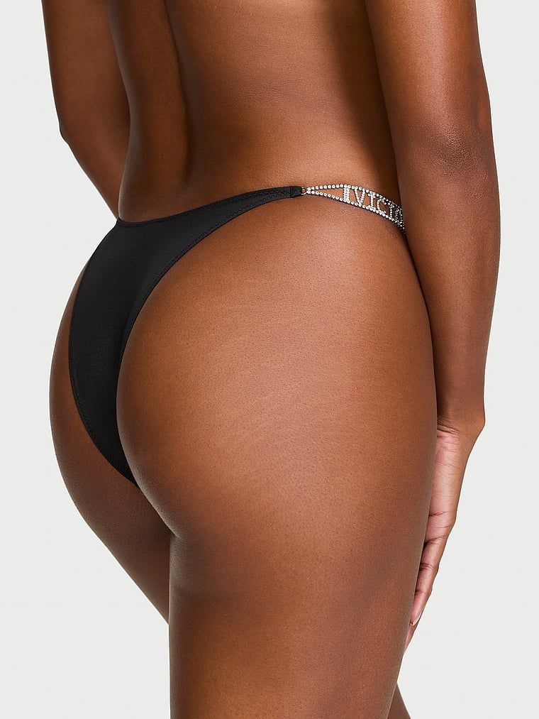 Brazilske gaćice sa sjajnim prugama Shine loga. Proizvod je crn i dolazi iz kolekcije Very Sexy.