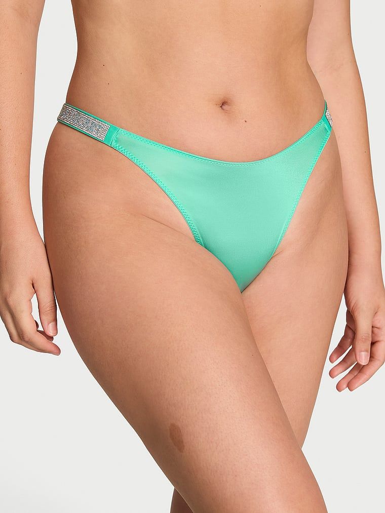 Tange s sjajnim naramenicama za sjaj. Proizvod je plave boje i dolazi iz kolekcije Very Sexy.