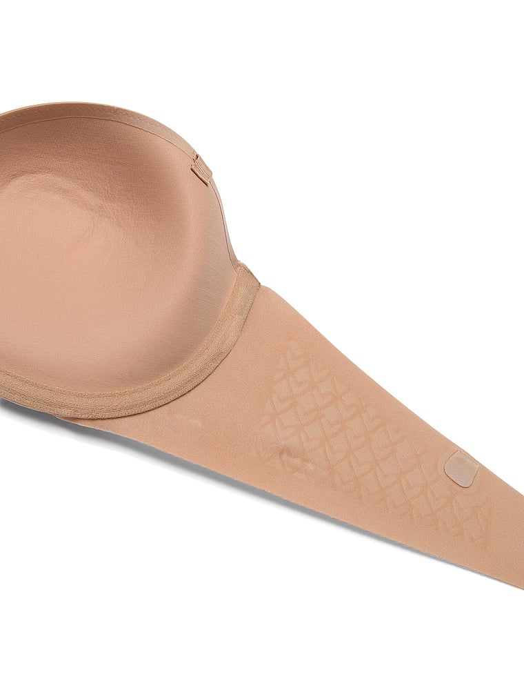 Uplift grudnjak bez naramenica za push-up. Proizvod je bež boje i dolazi iz kolekcije Invisible by Victoria's Secret.