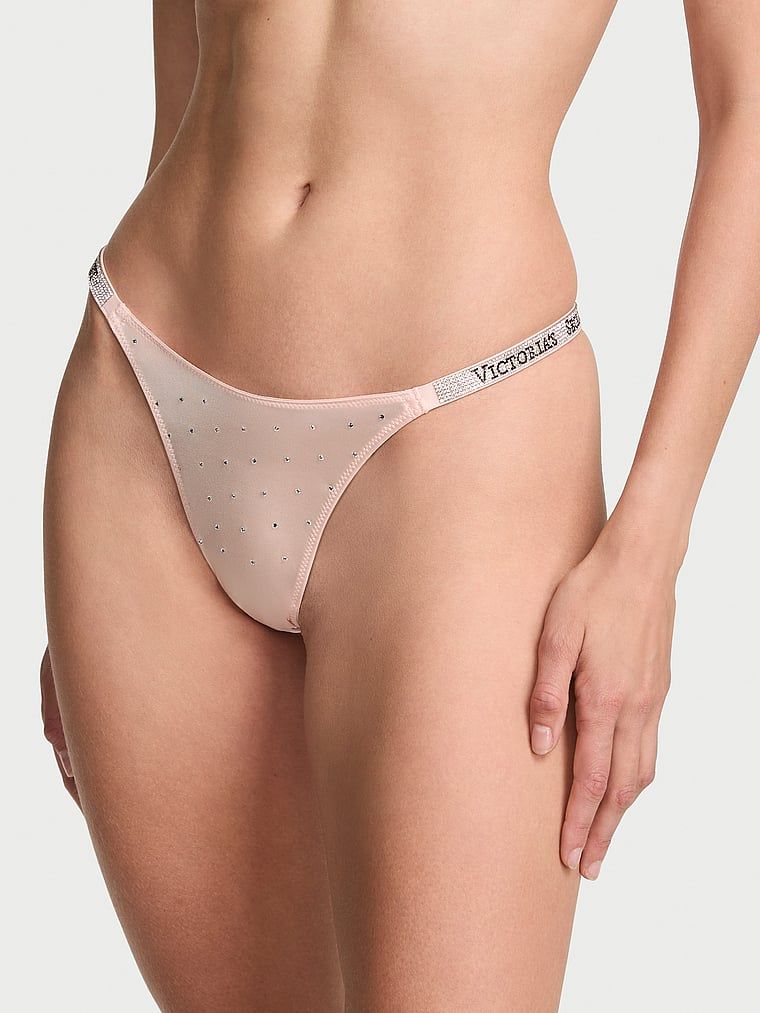 Točkica remena za sjaj tanga. Proizvod je ružičaste boje i dolazi iz kolekcije Very Sexy.