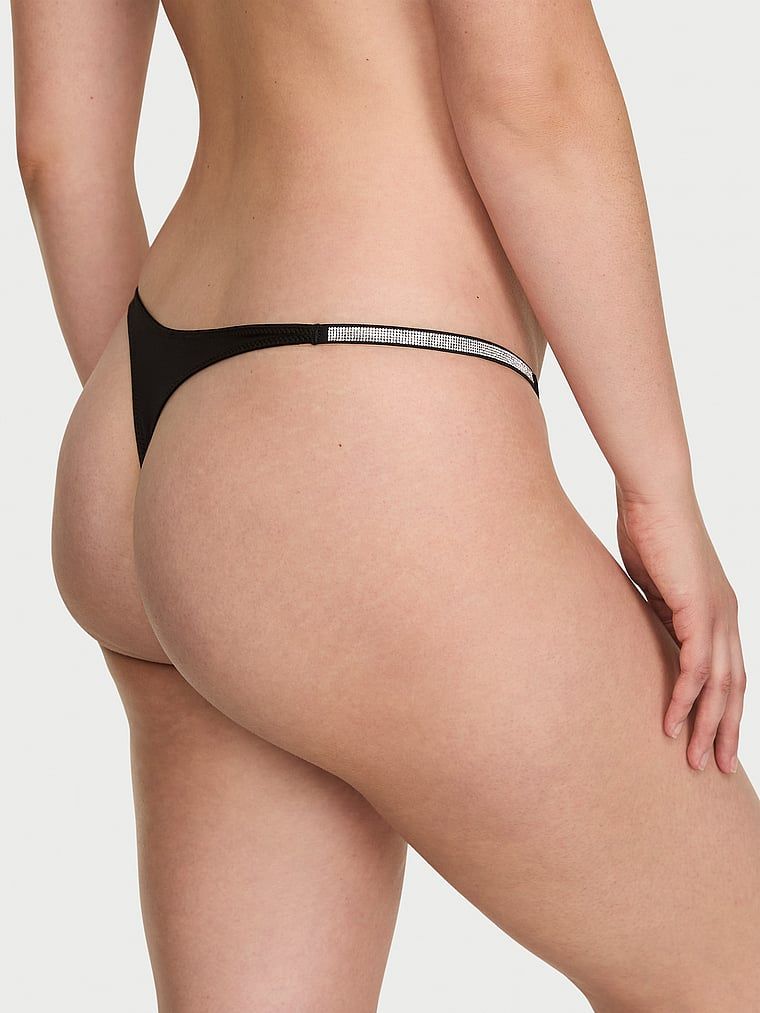 Luk za sjaj tanga. Proizvod je crne boje i dolazi iz kolekcije Very Sexy.