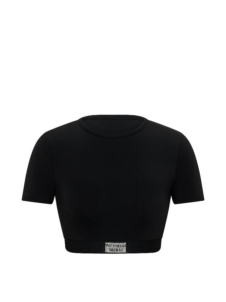Crop top pamučni bralet s kratkim rukavima Shine Patch. Proizvod je crne boje i dolazi iz kolekcije majica.