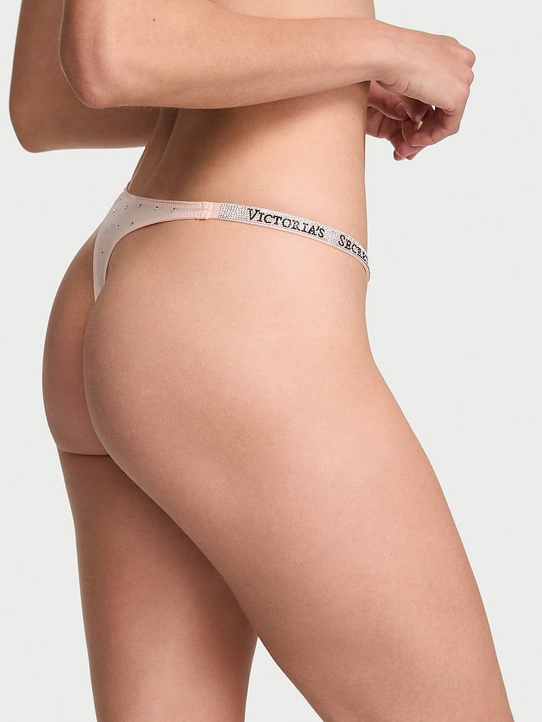 Točkica remena za sjaj tanga. Proizvod je ružičaste boje i dolazi iz kolekcije Very Sexy.