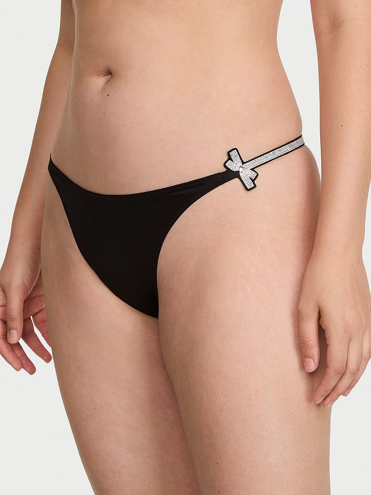 Luk za sjaj tanga. Proizvod je crne boje i dolazi iz kolekcije Very Sexy.