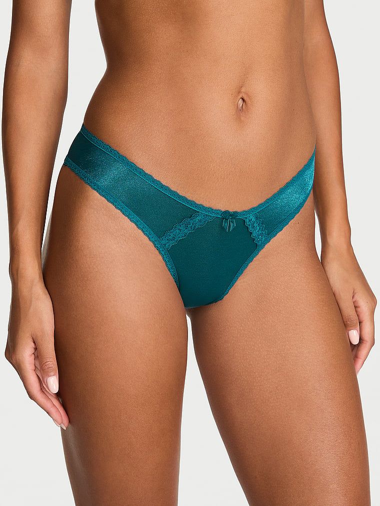 Sjajne brazilske gaćice s izrezima straga, prozirni brazilski sjaj. Proizvod je plave boje i dolazi iz kolekcije Dream Angels.